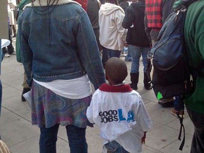 Demonstrators protest federal immigration policy in downtown L.A., Dec. 15, 2011.