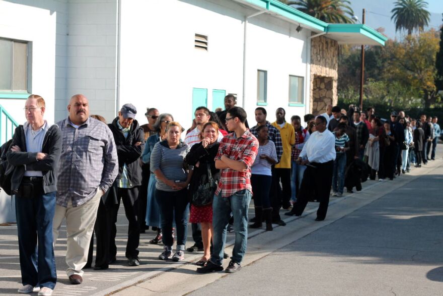 Hundreds of job seekers lined up around the perimeter of the Metropolitan Baptist Church in Altadena for a Walmart hiring event. Walmart is hiring 65 people for its Neighborhood Market store in Altadena.