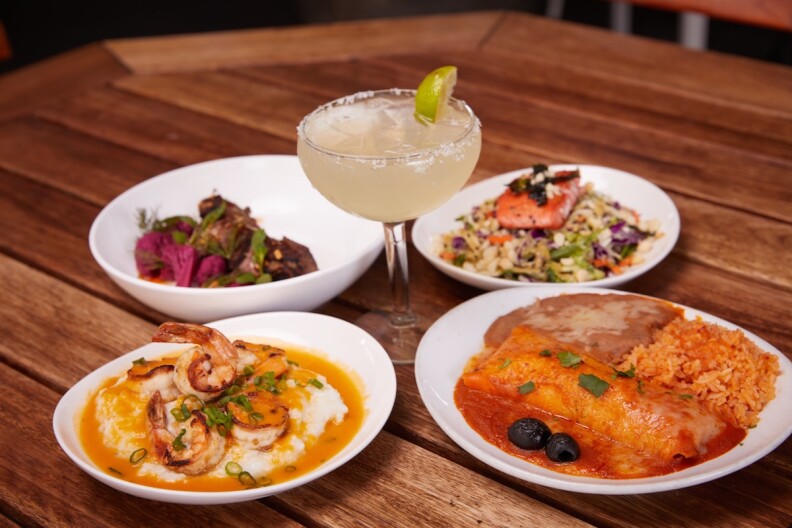 four dishes from a progessive dinner menu surround a margarita