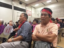 More than 300 people turned out to oppose the Keiro sale, many wearing red bands in protest.